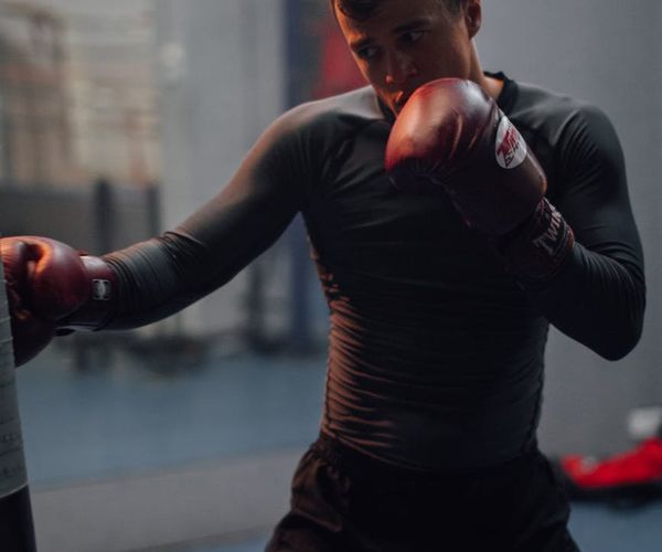Man in athletic wear looking determined and focused during a workout.